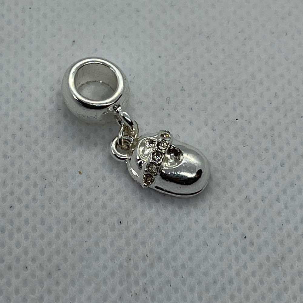 Avon silver tone baby shoe bracelet charm